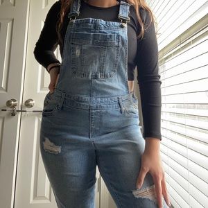 Cute denim overalls.  With buttons on the sides.